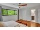 Sun-filled main bedroom featuring hardwood floors and an ensuite bathroom at 3270 Leslie Ne Ct, Atlanta, GA 30345