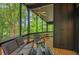 Comfortable screened porch featuring neutral furniture and an outdoor ceiling fan at 3270 Leslie Ne Ct, Atlanta, GA 30345
