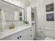Well-lit bathroom featuring modern fixtures, a stylish mirror, and ample storage at 3992 Camden Way, Alpharetta, GA 30005
