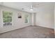 Bright, airy bedroom with neutral carpet, two windows offering natural light, and ceiling fan at 3992 Camden Way, Alpharetta, GA 30005