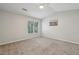Bright bedroom with neutral carpeting, vaulted ceiling, and a large window offering natural light at 3992 Camden Way, Alpharetta, GA 30005