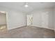 Spacious bedroom with neutral carpet, a ceiling fan, and access to an ensuite bathroom at 3992 Camden Way, Alpharetta, GA 30005