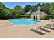 Inviting community pool with ample lounge chairs, set within a well-maintained, green outdoor space at 3992 Camden Way, Alpharetta, GA 30005