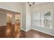 Sunlit dining area with hardwood floors and adjacent views of the kitchen and open living spaces at 3992 Camden Way, Alpharetta, GA 30005