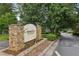 Community entrance sign for Camden Pond surrounded by landscaping, creating an inviting feel to the neighborhood at 3992 Camden Way, Alpharetta, GA 30005