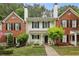 Charming townhome with brick accents, a manicured lawn and beautiful landscaping at 3992 Camden Way, Alpharetta, GA 30005