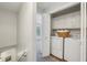 Convenient laundry room with a washer, dryer, and cabinetry for storage at 3992 Camden Way, Alpharetta, GA 30005