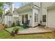 Cozy patio with a rocking chair, table, and small garden; perfect for outdoor relaxation and gatherings at 3992 Camden Way, Alpharetta, GA 30005