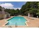 Community pool with several lounge chairs and shade providing a great place to relax and enjoy the outdoors at 3992 Camden Way, Alpharetta, GA 30005