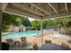 Inviting community pool area featuring comfortable seating and shaded spots for relaxation, with lush greenery nearby at 3992 Camden Way, Alpharetta, GA 30005