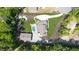 Aerial view of landscaped backyard featuring play area, outbuilding, pool and stone patio at 604 Trinity Church Rd, Canton, GA 30115