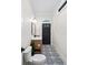 Compact bathroom with patterned tile floor, a modern vanity, and a toilet at 604 Trinity Church Rd, Canton, GA 30115