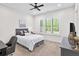 Cozy bedroom featuring a comfortable bed, stylish decor, and a bright window with natural light at 604 Trinity Church Rd, Canton, GA 30115