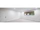 Expansive room with modern recessed lighting and a window that allows natural light at 604 Trinity Church Rd, Canton, GA 30115