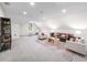 Open bonus room featuring plush carpet, natural lighting, and a cozy seating arrangement at 604 Trinity Church Rd, Canton, GA 30115