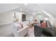 Spacious bonus room featuring a comfortable seating area, shelving, and natural light at 604 Trinity Church Rd, Canton, GA 30115