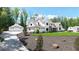 Lovely home with an oversized three car garage and lush landscaping on a sunny day at 604 Trinity Church Rd, Canton, GA 30115
