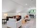 Spacious living room featuring a sloped ceiling, comfortable seating, and large windows at 604 Trinity Church Rd, Canton, GA 30115