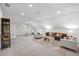 Bright bonus room featuring a seating area and charming decor, perfect for relaxation and entertaining at 604 Trinity Church Rd, Canton, GA 30115