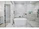 A luxurious main bathroom showcases a large, free-standing tub and frameless shower at 604 Trinity Church Rd, Canton, GA 30115