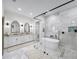 Bright and modern bathroom with soaking tub, glass shower, and double vanity at 604 Trinity Church Rd, Canton, GA 30115
