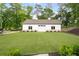 View of a modern outbuilding with a well-manicured lawn and landscape at 604 Trinity Church Rd, Canton, GA 30115