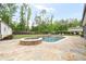 Backyard pool and hot tub, with trees and greenery at 604 Trinity Church Rd, Canton, GA 30115