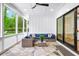 Spacious screened porch with outdoor seating and view of the manicured lawn at 604 Trinity Church Rd, Canton, GA 30115