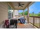 Cozy covered back porch with outdoor seating, ceiling fan, and a grill, perfect for relaxation at 113 Osier Dr, Mcdonough, GA 30252