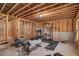 Spacious unfinished basement with workout equipment and exposed joists, offering customization potential at 113 Osier Dr, Mcdonough, GA 30252