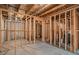 Large unfinished basement with wood framing and concrete floor, offering potential for customization at 113 Osier Dr, Mcdonough, GA 30252