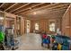 Unfinished basement space with exposed ceiling joists and wood framing, ready for customization at 113 Osier Dr, Mcdonough, GA 30252