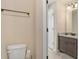Toilet and granite vanity in a beige-walled bathroom at 113 Osier Dr, Mcdonough, GA 30252