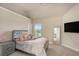Bright bedroom featuring a comfortable bed, and large window view at 113 Osier Dr, Mcdonough, GA 30252
