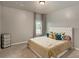 Neutral bedroom with a plush upholstered headboard and side table at 113 Osier Dr, Mcdonough, GA 30252