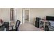 Spacious bedroom with neutral carpet and walls, a doorway to a bathroom, and space for work and relaxation at 113 Osier Dr, Mcdonough, GA 30252