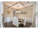 Elegant dining room featuring coffered ceiling and modern chandelier at 113 Osier Dr, Mcdonough, GA 30252