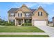 Beautiful two-story brick home with well-manicured lawn and attached two car garage at 113 Osier Dr, Mcdonough, GA 30252