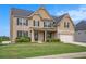 Charming two-story brick home with well-maintained lawn and landscaping at 113 Osier Dr, Mcdonough, GA 30252
