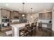 Spacious kitchen featuring an island, granite countertops, stainless appliances, and hardwood floors at 113 Osier Dr, Mcdonough, GA 30252