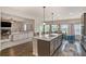 Open-concept kitchen with a large island and stainless steel appliances at 113 Osier Dr, Mcdonough, GA 30252