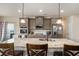 Bright kitchen featuring stainless steel appliances, granite counters, and pendant lighting at 113 Osier Dr, Mcdonough, GA 30252