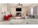 Inviting living room with fireplace, lots of seating, and neutral decor at 113 Osier Dr, Mcdonough, GA 30252