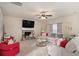 Comfortable living room featuring a stone fireplace and ample seating at 113 Osier Dr, Mcdonough, GA 30252