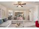 Open concept living room adjacent to kitchen with natural light at 113 Osier Dr, Mcdonough, GA 30252