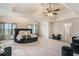 Expansive main bedroom featuring a round bed, large windows, and chic decor, offering ample space at 113 Osier Dr, Mcdonough, GA 30252