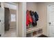Functional mudroom with built-in bench and storage at 113 Osier Dr, Mcdonough, GA 30252