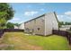 Spacious backyard with green lawn, fence, and patio area, perfect for outdoor entertaining and relaxation at 1340 Delo Ln, Cumming, GA 30041