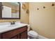 Bathroom with vanity, toilet, mirror, and sink offering a functional layout and clean design at 1340 Delo Ln, Cumming, GA 30041