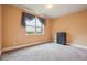 Cozy bedroom with a neutral color scheme, carpeted floors, and window that offers natural light at 1340 Delo Ln, Cumming, GA 30041